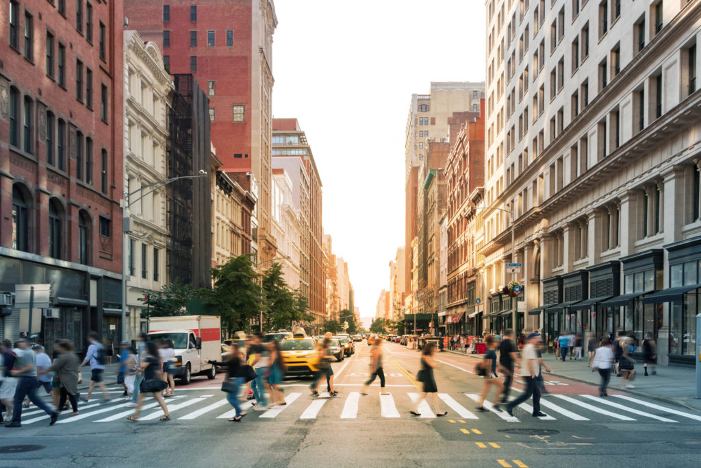 City sidewalk with pedestrians