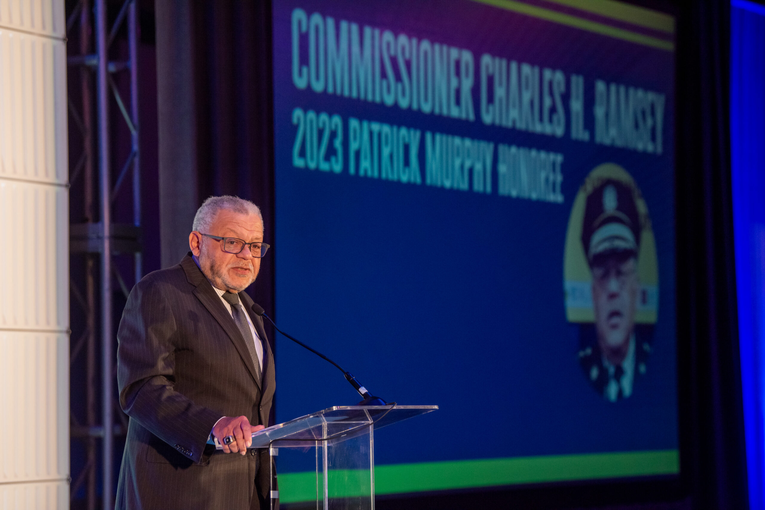 Commissioner Charles H. Ramsey gives a speech accepting the Commissioner Patrick V. Murphy award in 2023.