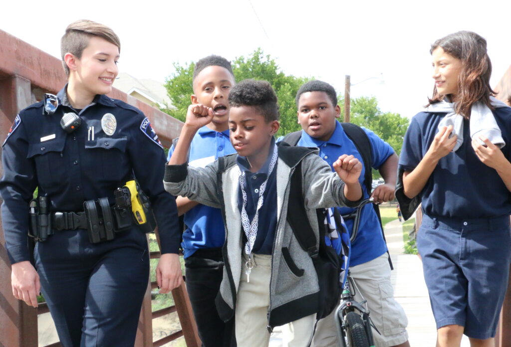 Woman police officer with kids