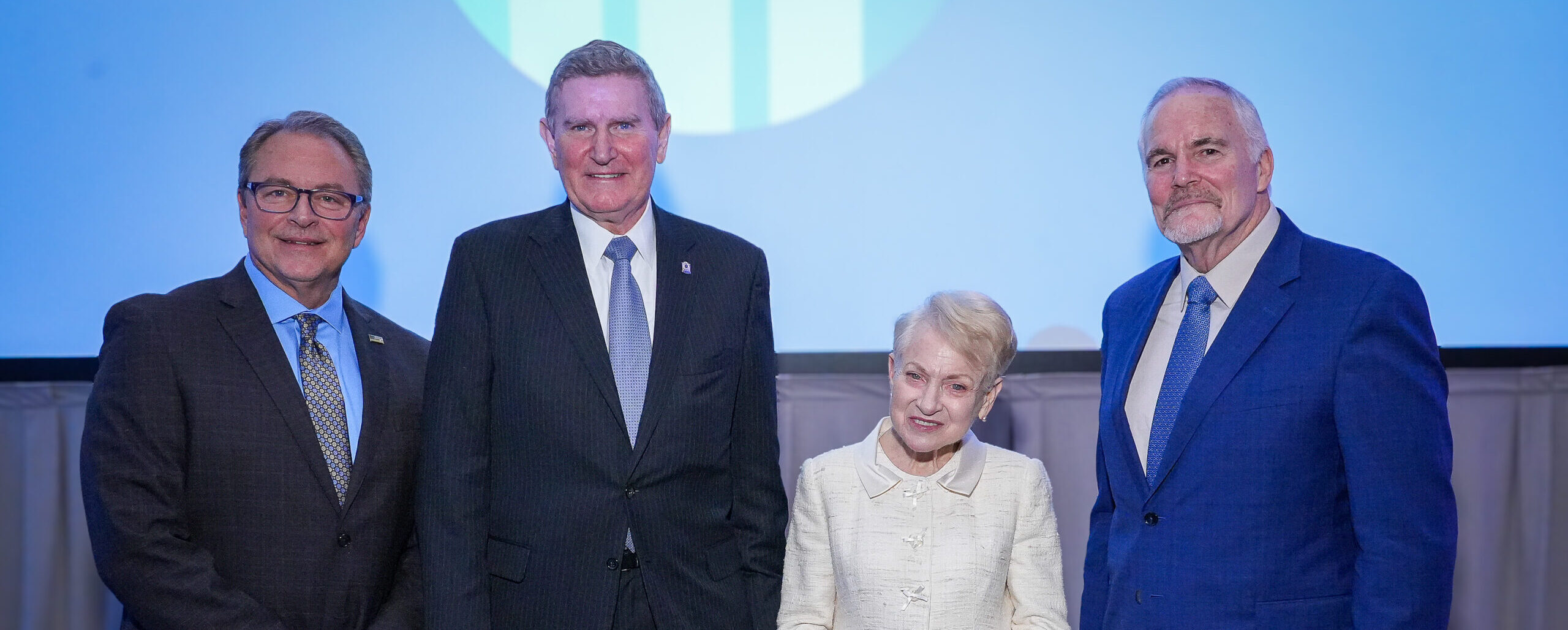 Board Chair Laurie Robinson, President Jim Burch, and the 2025 award honorees