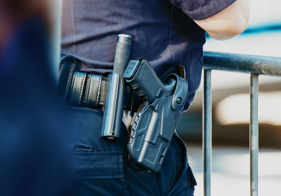 Manhattan 2019. Behind the police with gun belt, close up